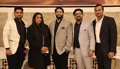 A batch of alumni posing together for a photo