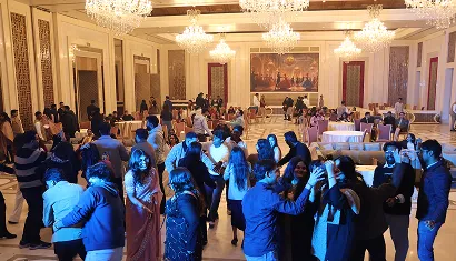 A batch of alumni posing together for a photo